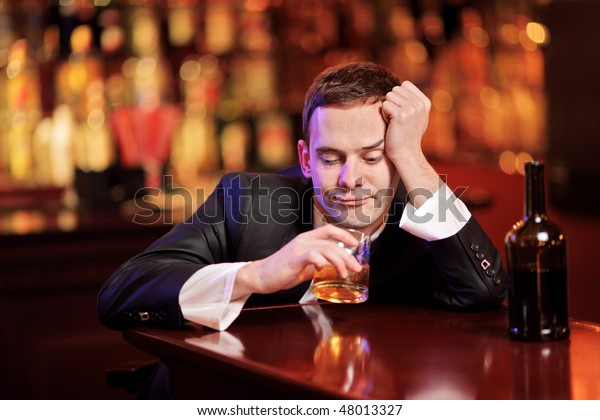young-drunk-man-drinking-whiskey-600w-48013327.jpg